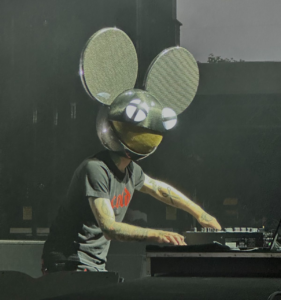 Deadmau5 performing live at Belknap Park in 2023, his iconic helmet glowing above the crowd