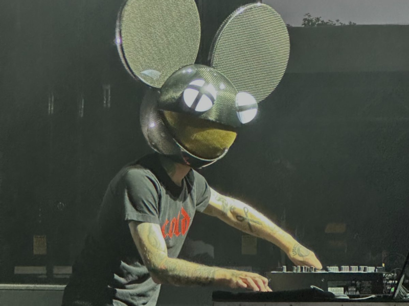 Deadmau5 performing live at Belknap Park in 2023, his iconic helmet glowing above the crowd
