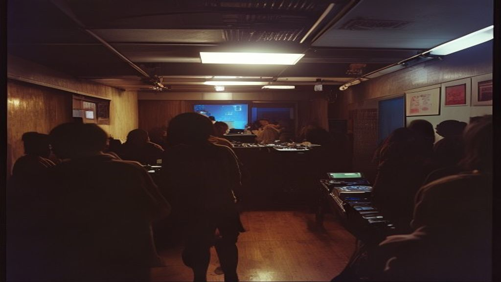 Peggy Gou performing at a Seoul basement club, silhouetted figure at DJ booth