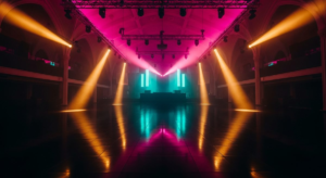 Vast empty club dance floor with dramatic ceiling lighting rig casting hot pink and gold beams, teal wash on far wall
