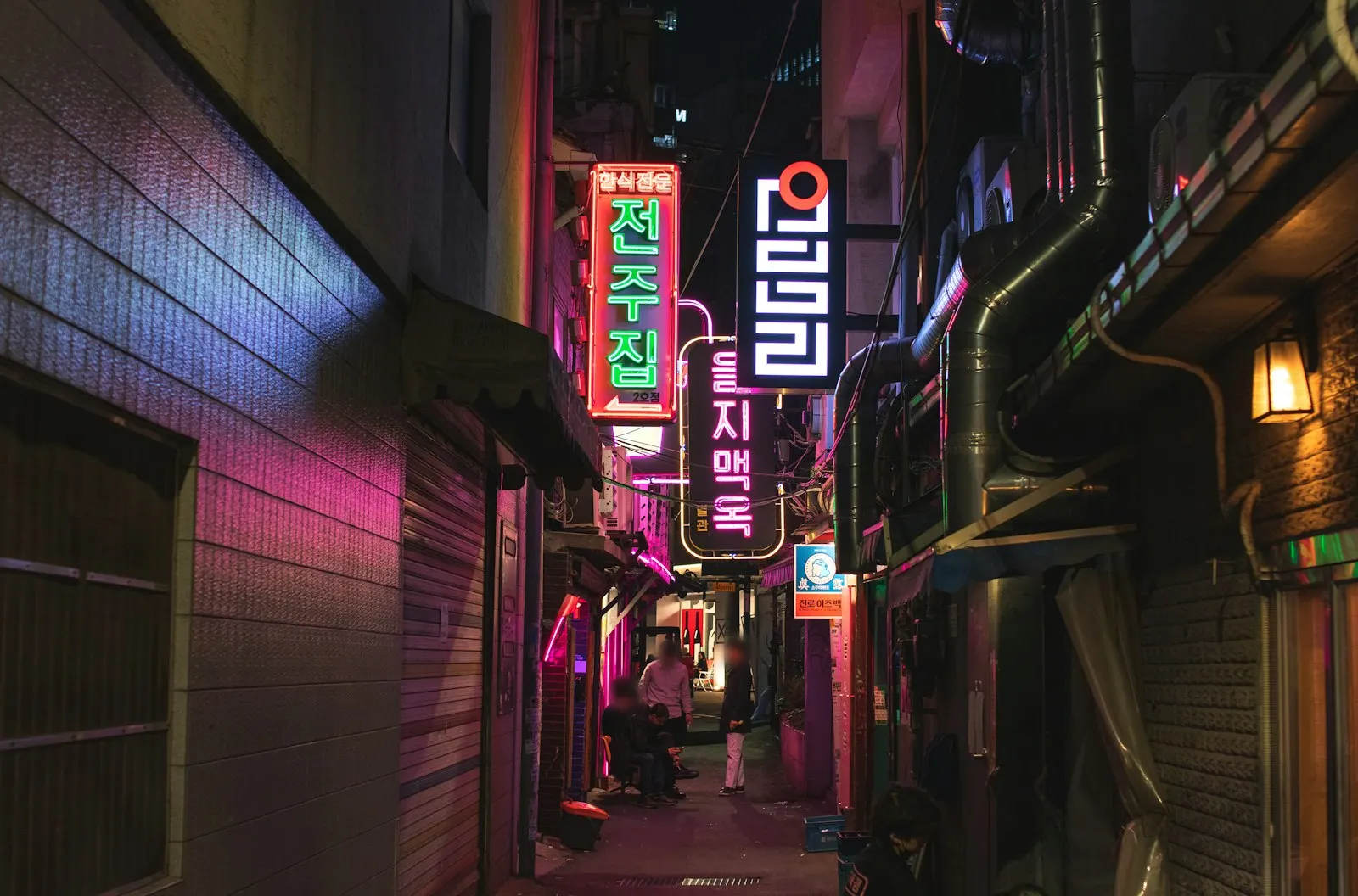 A narrow Euljiro alley at night with hangul neon signs, Seoul