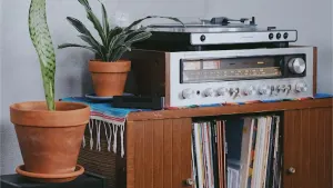 Vintage receiver on a wooden cabinet, music you own