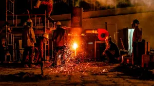 Workshop forge glowing at night, the factory belt after dark