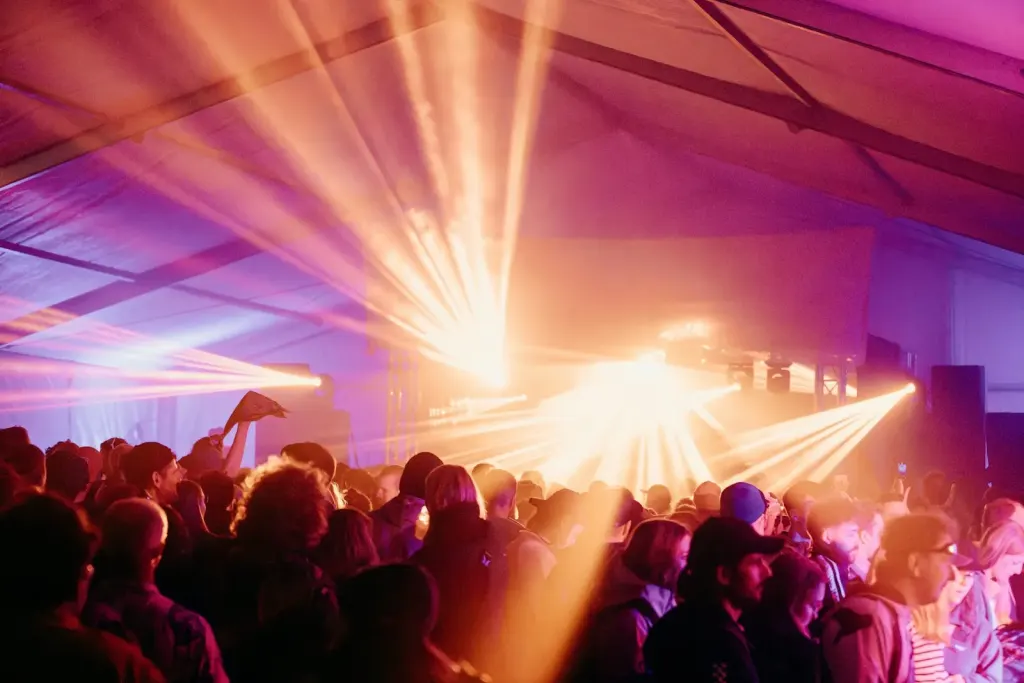 festival crowd orange beams