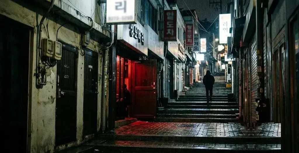 An Itaewon hillside alley at night