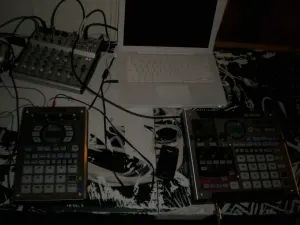 A Roland SP-404 next to an SP-555