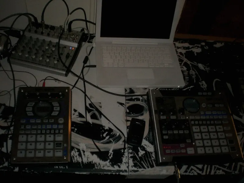 A Roland SP-404 next to an SP-555