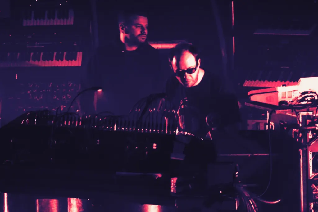 The Chemical Brothers performing live in 2007 under coloured stage lights