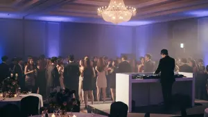 Company year end party in a Seoul hotel ballroom, with guests dancing in front of the DJ booth