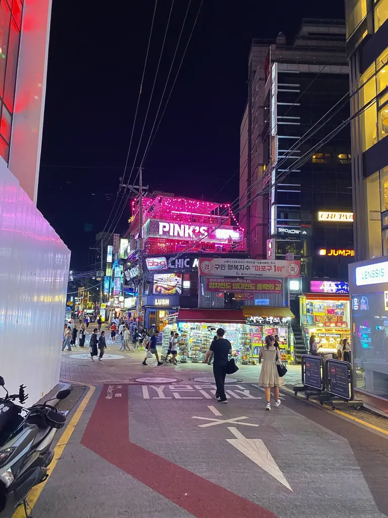 Neon signs on a Hongdae street at night