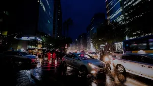 Traffic and wet streets in Gangnam on a rainy evening