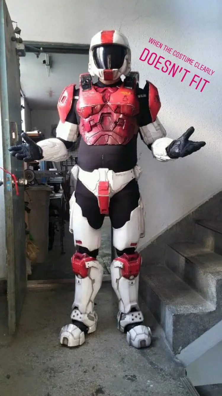 A person in a full sci fi armour costume that clearly does not fit