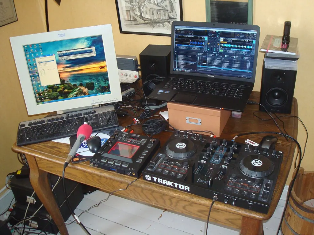 A Traktor Kontrol S2 controller set up beside a laptop