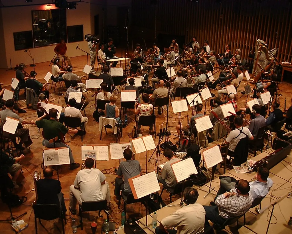 An orchestra recording session in a studio