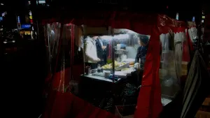 A red pojangmacha street food tent glowing at night in Seoul